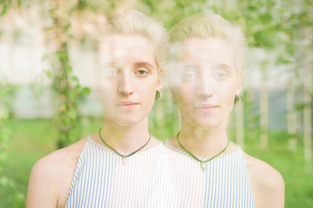 Double exposure half length of young handsome caucasian woman designer looking in camera - art, creative, inspiration conceptの写真素材