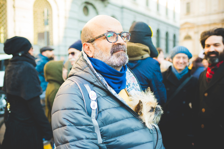 MILAN, ITALY - JANUARY 23: unmarried couples manifestation in Milan on January 23, 2016. Man with hid dog manifesting for unmarried gay, lesbians and heterosexual equal civil rights couplesのeditorial素材