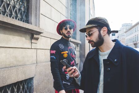 Milan, Italy - February 25, 2016: people attending models and vips in the streets during Milan Fashion Week Women Fall/Winter 2015/2016のeditorial素材