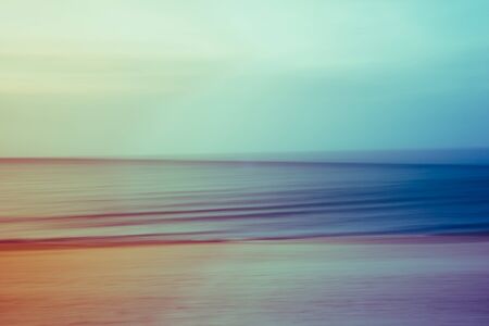 A vintage filtered abstract artistic ocean seascape with blurred panning motionの写真素材