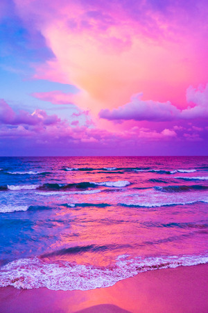 Wonderful sunset over a quiet sea and view of seafront in Sardinia, Italy.の写真素材
