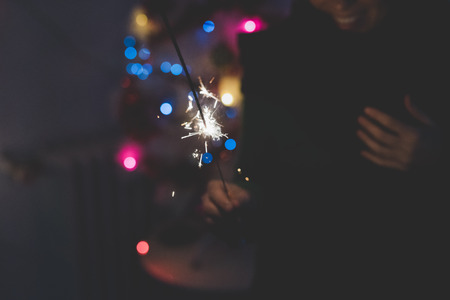 Close up on a sparkler firework for new year's eve celebrations - celebrate, holiday conceptの写真素材
