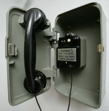 phone on the wall.Russian text on the table :の写真素材