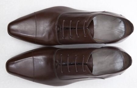 men's  brown leather shoes on whiteの写真素材