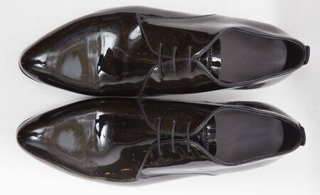 men's patent-leather shoes on whiteの写真素材