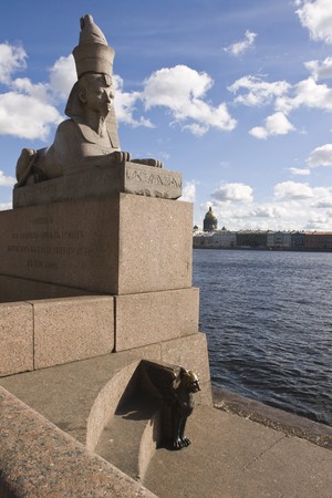 The stone sculpture of the sphinx found during the excavations in the Thebes, the capital of the ancient Egypt, had been installed on granite pier of the Neva River Embankment, by the building of the Saint Petersburg Art Academy. St. Petersburg. Russiaの写真素材
