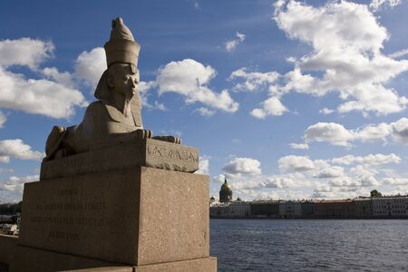 The stone sculpture of the sphinx found during the excavations in the Thebes, the capital of the ancient Egypt, had been installed on granite pier of the Neva River Embankment, by the building of the Saint Petersburg Art Academy. St. Petersburg. Russiaの写真素材