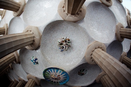 BARCELONA, SPAIN - JULY 07: Park guell in Barcelona with mosaic medallions on the ceiling of the terrace.The vibrant colors of the tiles are breathtaking on July 07, 2011 in Barcelona, Spain.のeditorial素材