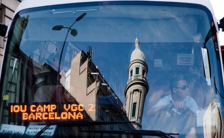 BARCELONA, SPAIN - JULY 16:City Transportation. Reflection of buildings in the windshield of the bus.  July 13, 2011 in Barcelona, Spain.のeditorial素材