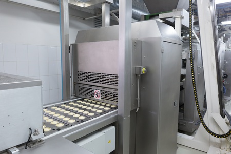 Pastry  Pastry on a conveyor  A lot of cookies 