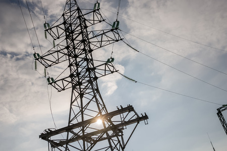a high voltage power pylons against blue sky