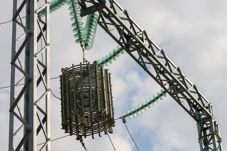 a high voltage power pylons against blue skyの写真素材