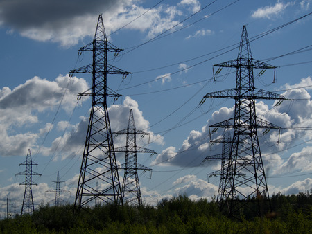 a high voltage power pylons against blue sky