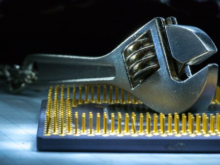 Adjustable wrench and the computer processor.の写真素材