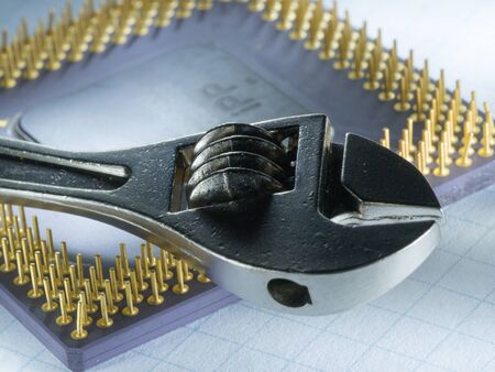 Adjustable wrench and the computer processor.の写真素材