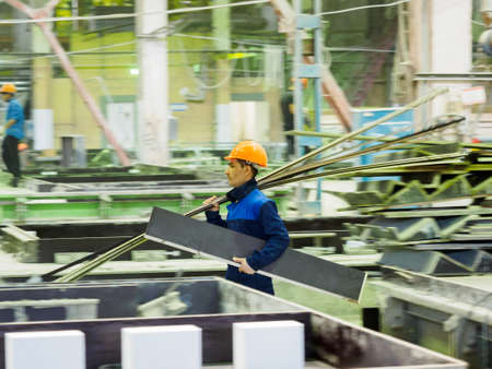 Gatchina, Russia - July 23 2019. 
Workers in the workshop of the  House-building plant "Gatchinsky SSK", producing panels for construction and reinforced concrete structures.のeditorial素材
