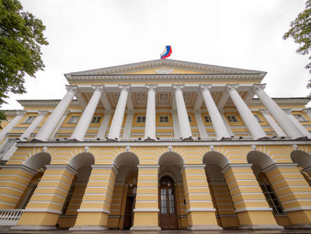 Saint Petersburg, Russia - July 9 2019. 
Facade of the Smolny Institute (the official residence of the governor of St.Peterburg now) with a Lenin statue in the foreground. Russia.のeditorial素材