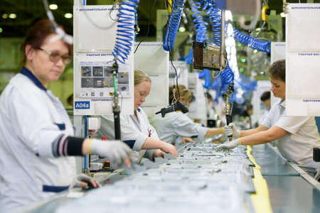 Saint Petersburg, Russia - March 11 2016. 
Workers assemble TV in  TPV Technology television assembly factory.のeditorial素材