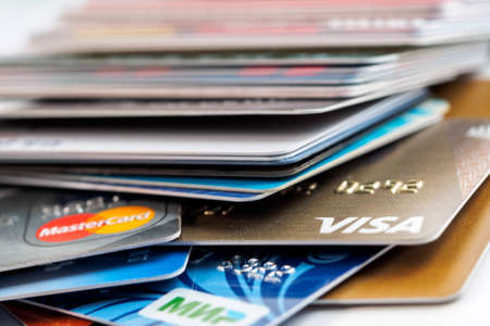 Saint Petersburg, Russia - February 3 2020. 
A pack of plastic bank cards of various payment systems.のeditorial素材