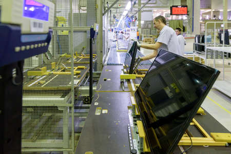 Saint Petersburg, Russia - March 11 2016. 
Workers assemble TV in  TPV Technology television assembly factory.のeditorial素材