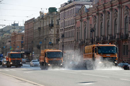 Saint Petersburg, Russia - April 7 2020. 
Cars with a disinfectant solution are processing Nevsky Prospekt in St. Petersburg during the Covid-19 pandemic.のeditorial素材