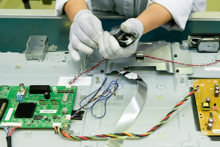 Saint Petersburg, Russia - March 11 2016. 
Workers assemble TV in  TPV Technology television assembly factory.のeditorial素材