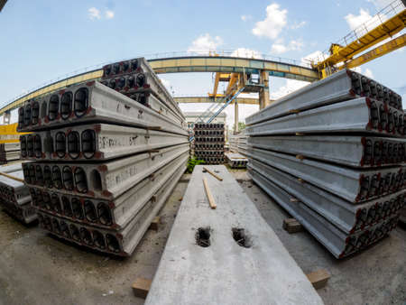 Gatchina, Russia - July 23 2019. 
Workers in the workshop of the  House-building plant "Gatchinsky SSK", producing panels for construction and reinforced concrete structures.のeditorial素材