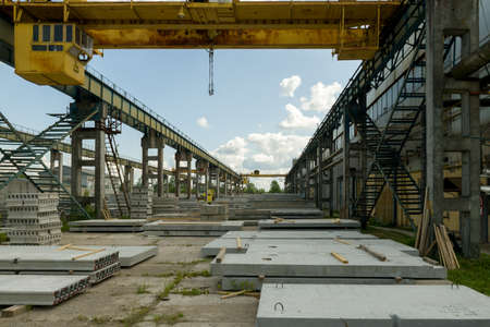 Gatchina, Russia - July 23 2019. 
Workers in the workshop of the  House-building plant "Gatchinsky SSK", producing panels for construction and reinforced concrete structures.のeditorial素材