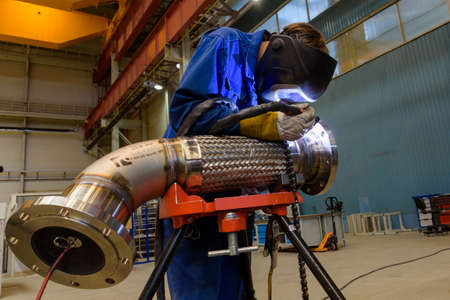 Saint Petersburg, Russia - August 17 2016. 
welder in Russian power machine building plant...