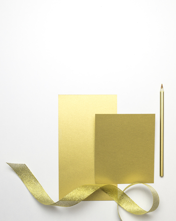 Cards from gold paper, top view.の写真素材