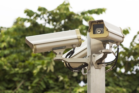 Check the movement of the traffic cameras  isolated on white with clipping path の写真素材