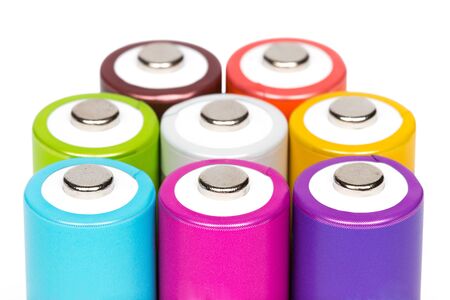 Multicolored AA size batteries isolated on white background.の写真素材