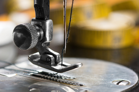 Close up of vintage sewing machine needle.