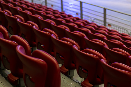 Rows of empty red concert chairs.の写真素材
