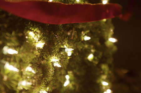 Christmas lights on garland with ribbonの写真素材