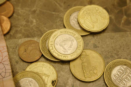 Coins on Stone tableの写真素材