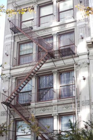Fire Escape down the side of a stone buildingの写真素材