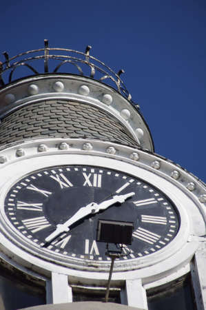 Large round clock on a towerの写真素材