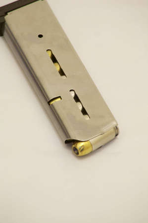 45 ACP ammunition in silver magazineの写真素材