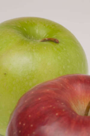 One green apple and one red apple in lineの写真素材