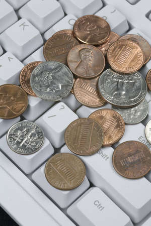 Conceptualization of questioning the US Dollar. Money on a keyboard surrounding the question mark key. の写真素材