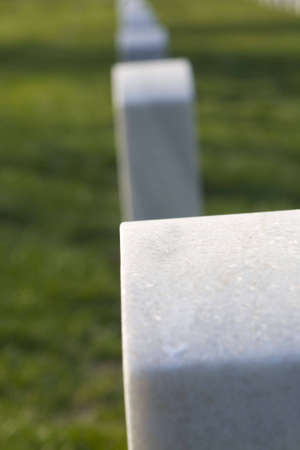 Line of white granite headstones in a national cemetary. Memorial markers at soldiers' graves.の写真素材
