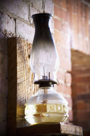 Hurricane lamp with oil on a wall. の写真素材