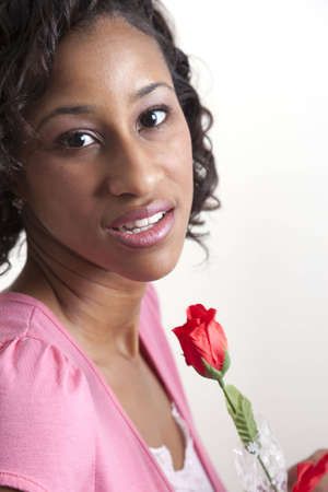 A womans reaction to getting a roseの写真素材
