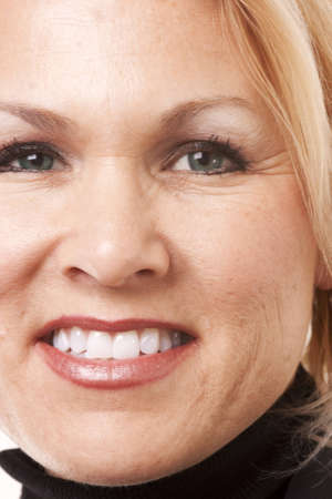 Closeup of a mature adult woman with a great smileの写真素材