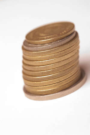 A stack of gold and silver coins. Finance or St. Patricks day concept of riches