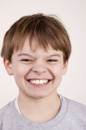 A young boy with a playful snarl expressionの写真素材