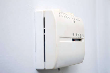 Control unit for a central heat and air system showing a low indoor temperatureの写真素材