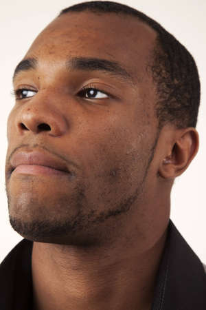 An african american man looking into the distance. Closeup headshot. の写真素材