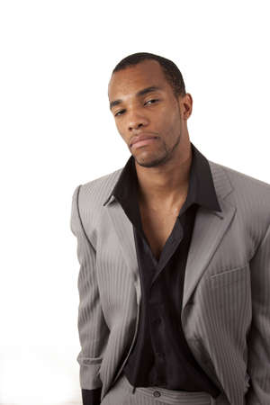 An african american man with a questioning look on his face dressed fashionablyの写真素材